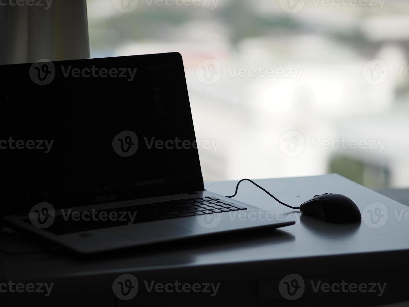 notebook with mouse on the table photo