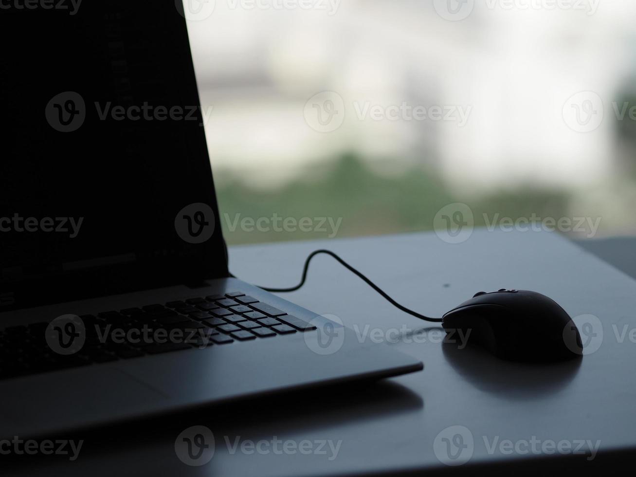 notebook with mouse on the table photo