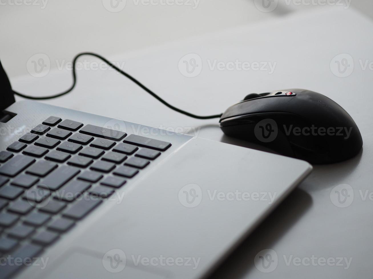 notebook with mouse on the table photo