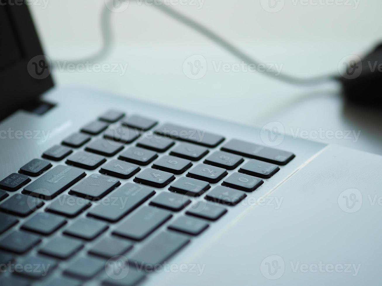 notebook with mouse on the table photo