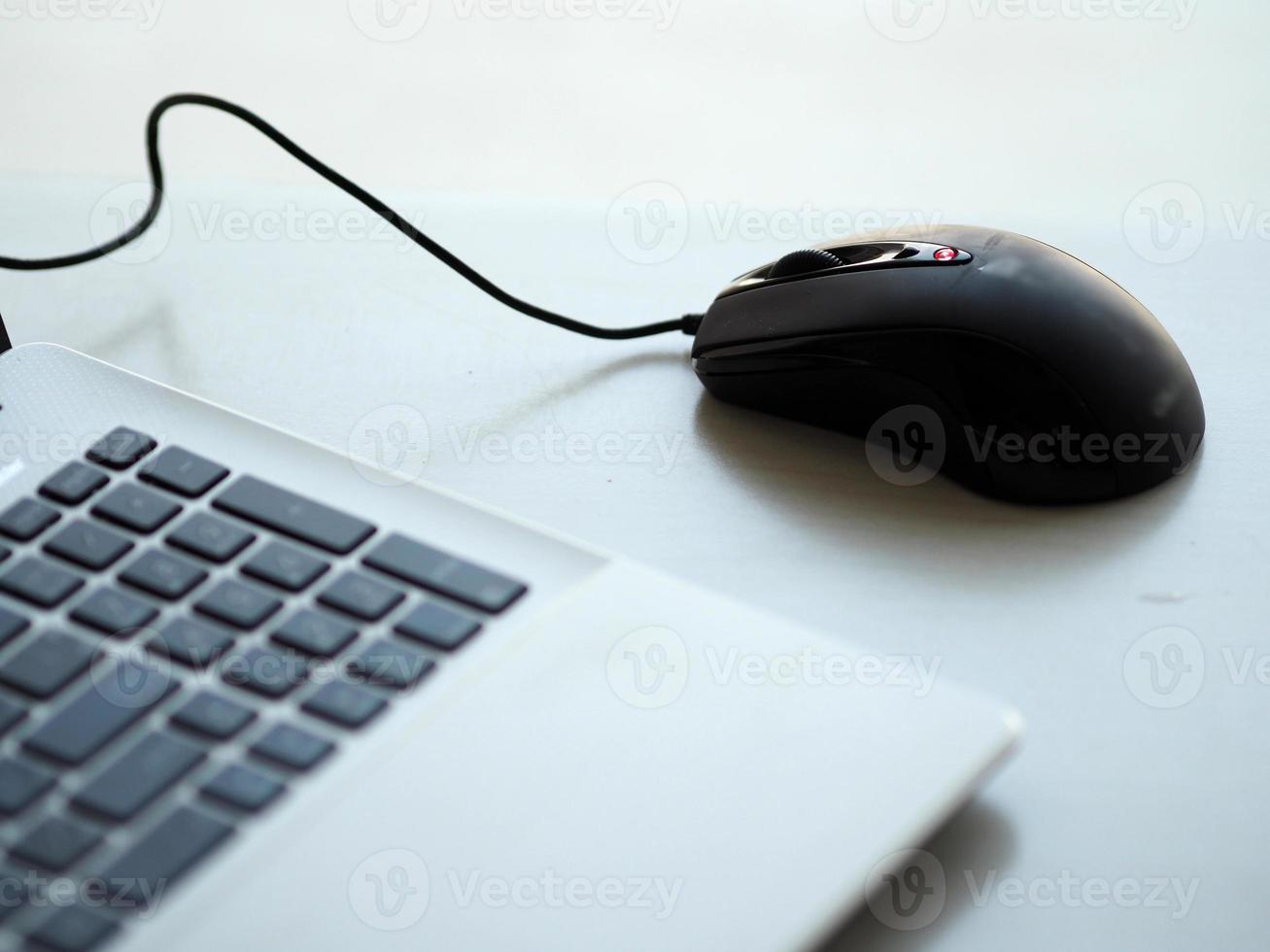 notebook with mouse on the table photo