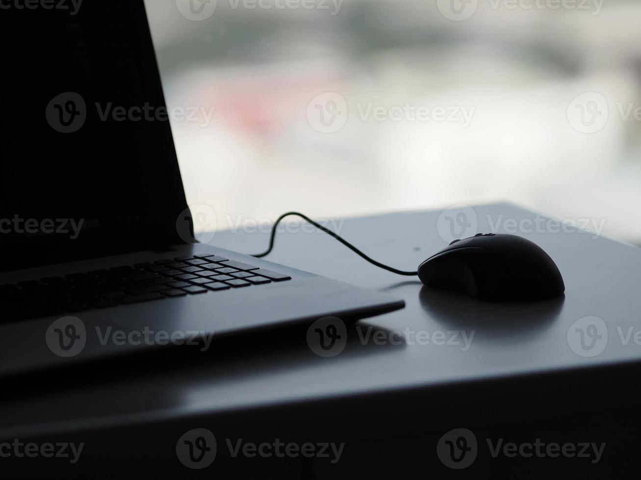 notebook with mouse on the table photo