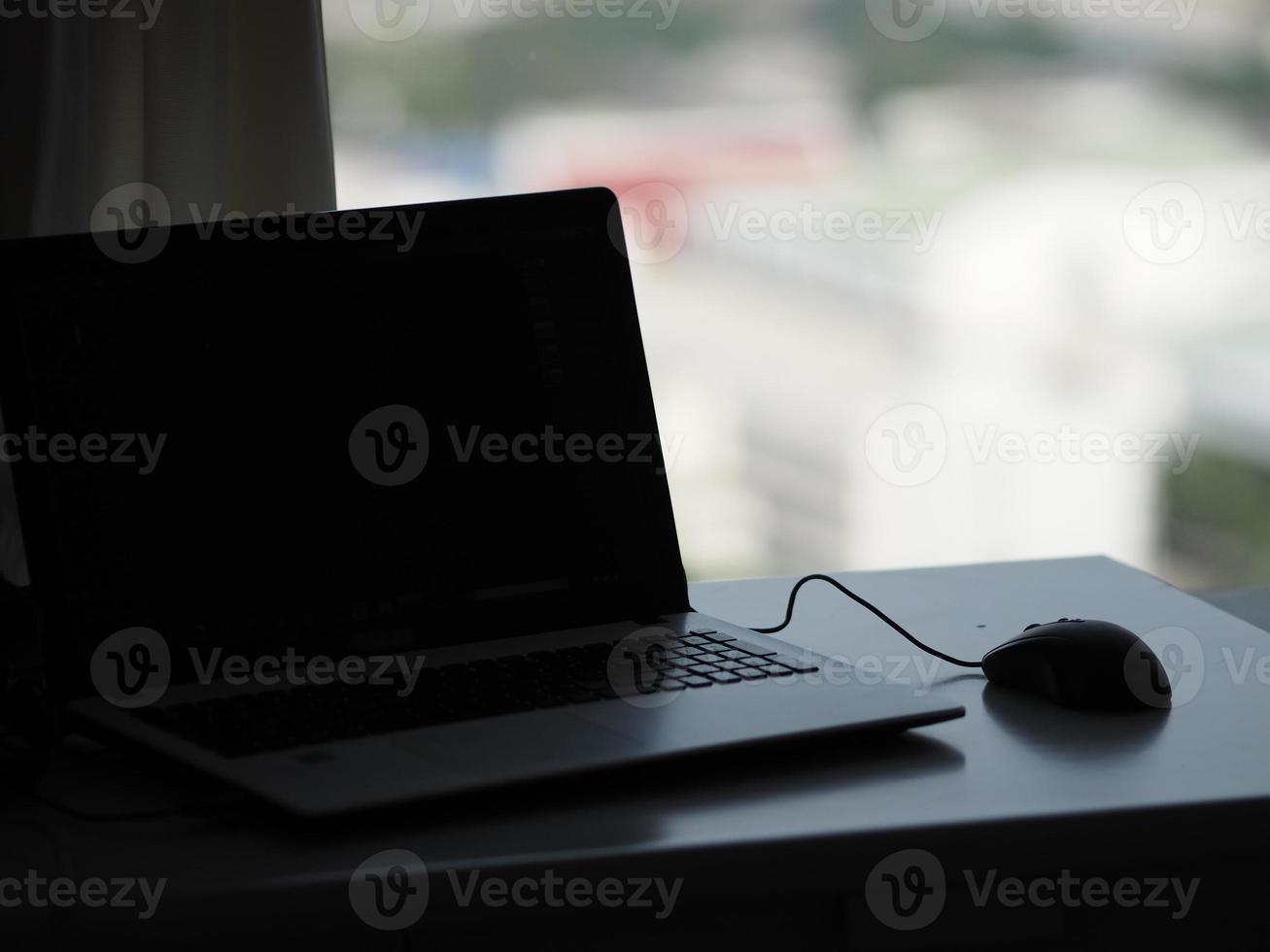 notebook with mouse on the table photo