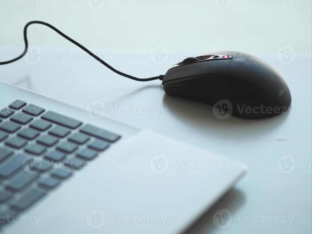 notebook with mouse on the table photo