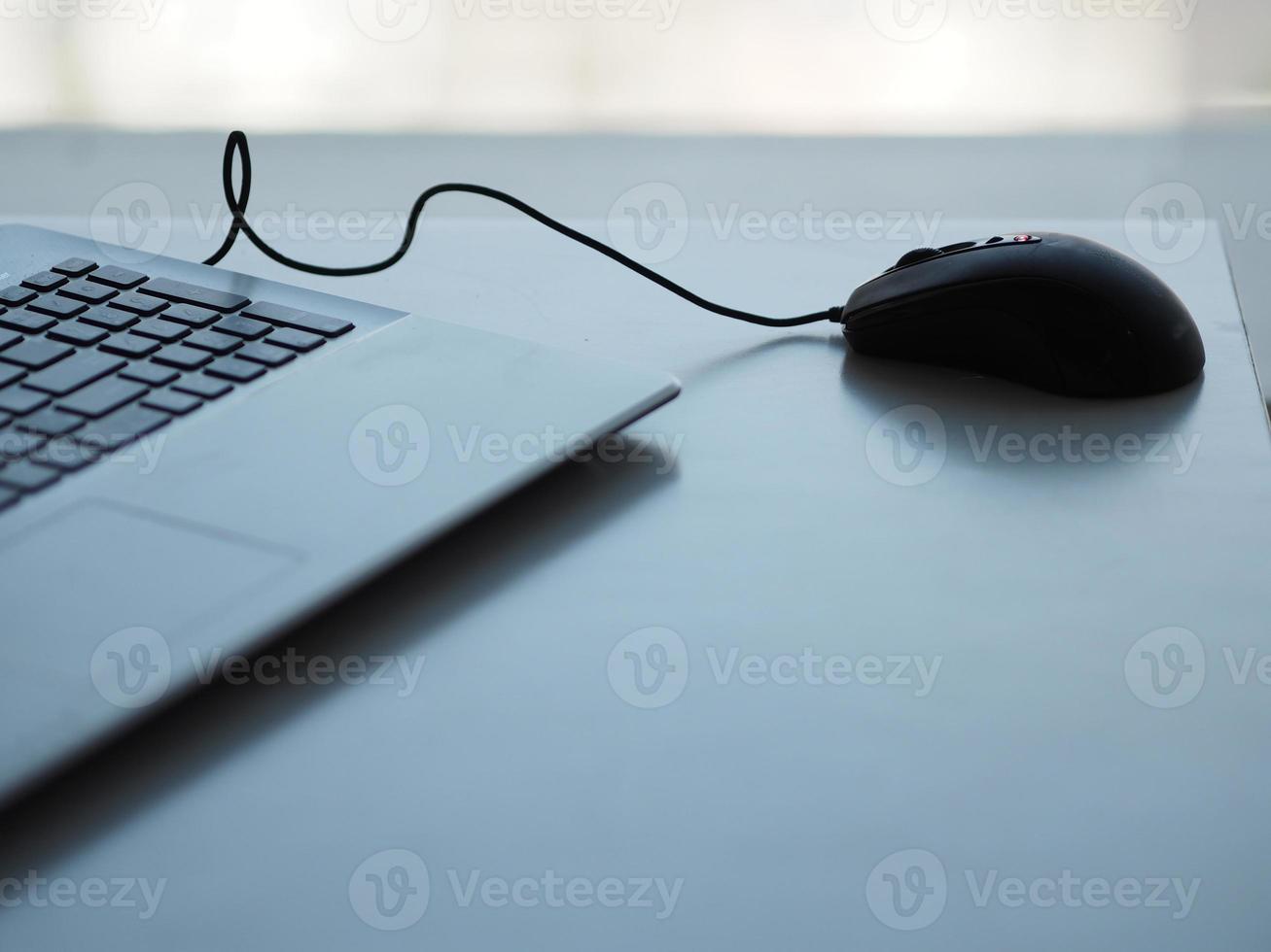 notebook with mouse on the table photo