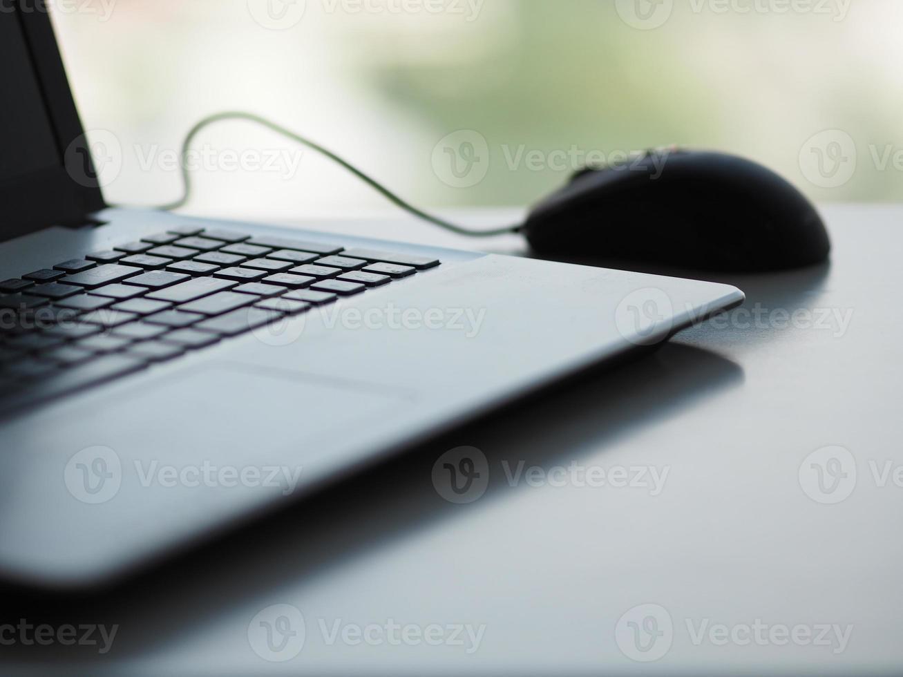 notebook with mouse on the table photo