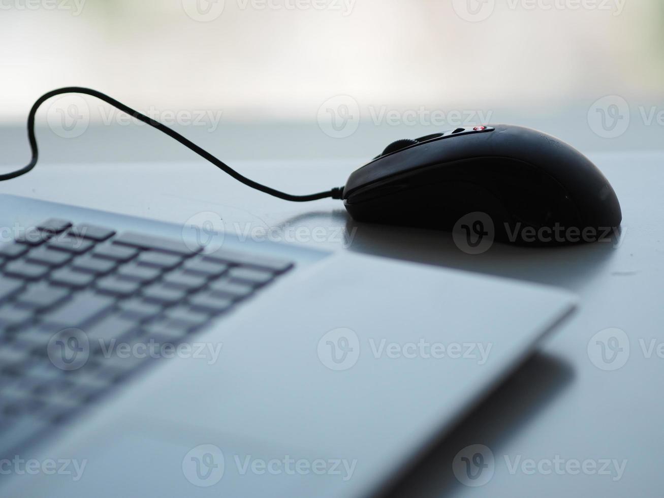 notebook with mouse on the table photo