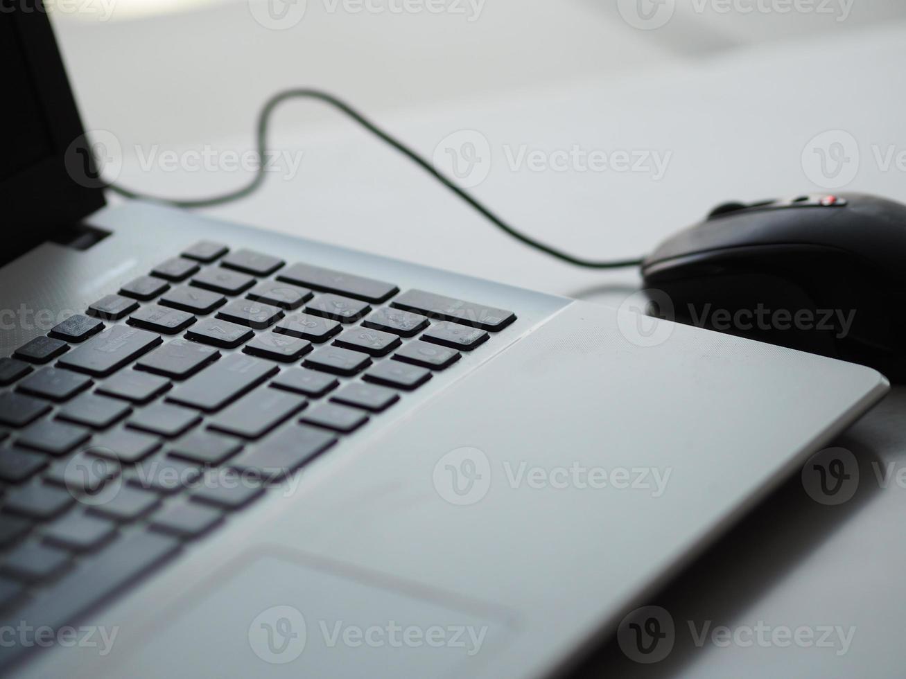 notebook with mouse on the table photo