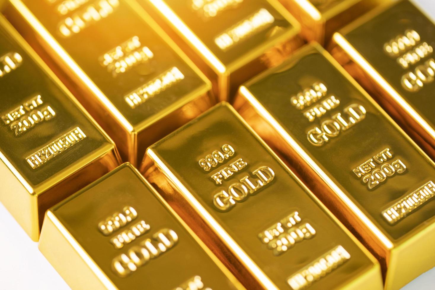 Gold bars on white background, row of gold bars financial business economy concepts, wealth and reserve success in business and finance photo