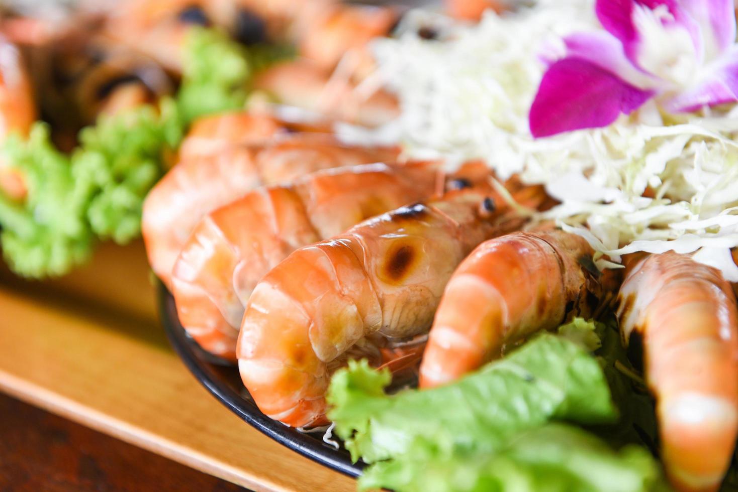 Grilled shrimp prawn with fresh vegetable and seafood sauce,  shrimps grilled serve on tray - seafood buffet Thai food photo