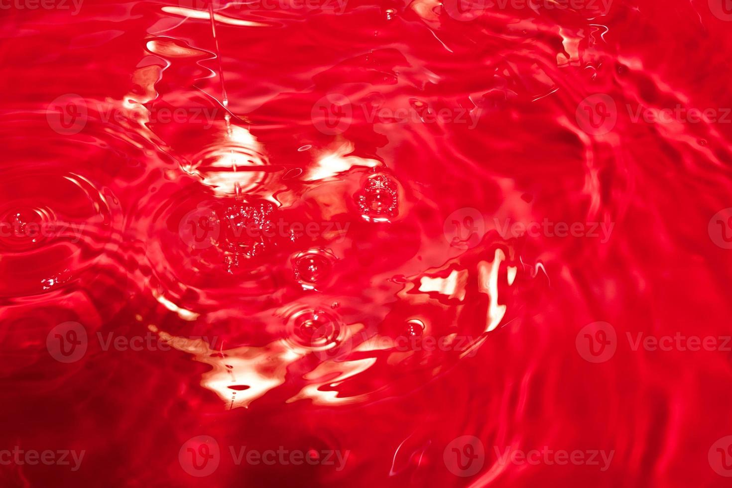 Red abstract chaotic backgroud with seamless pattern. Red liquid surface texture. photo