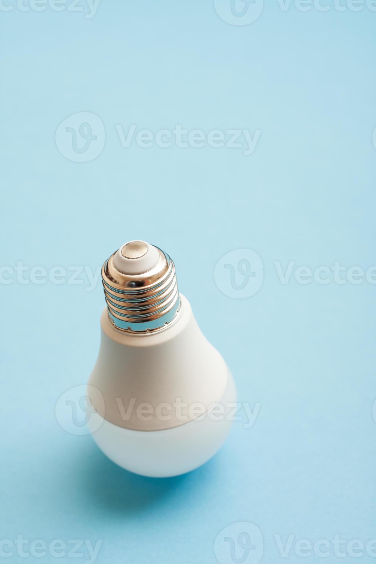 White light bulb standing upside down on blue background. 7765006 Stock