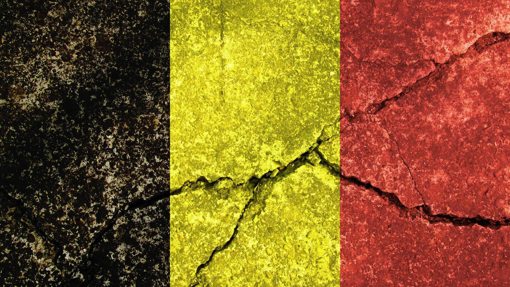 Belgium flag. Belgium flag on cracked concrete wall photo