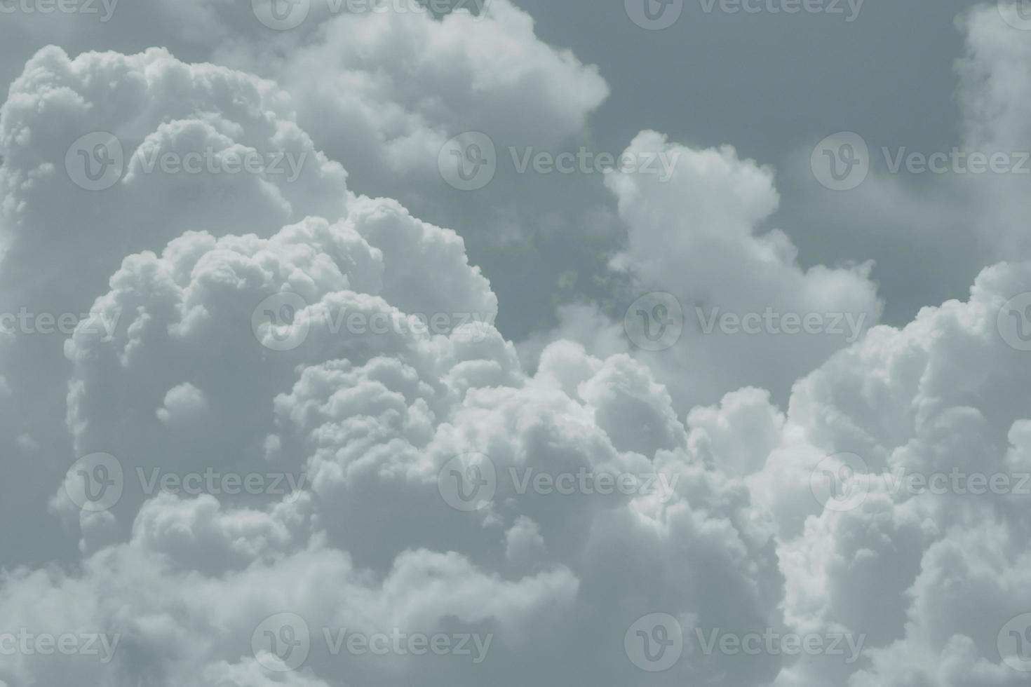 White fluffy clouds on sky. Soft touch feeling like cotton. White puffy cloudscape. Beauty in nature. Close-up group of white clouds texture background. White background for minimal pattern. photo
