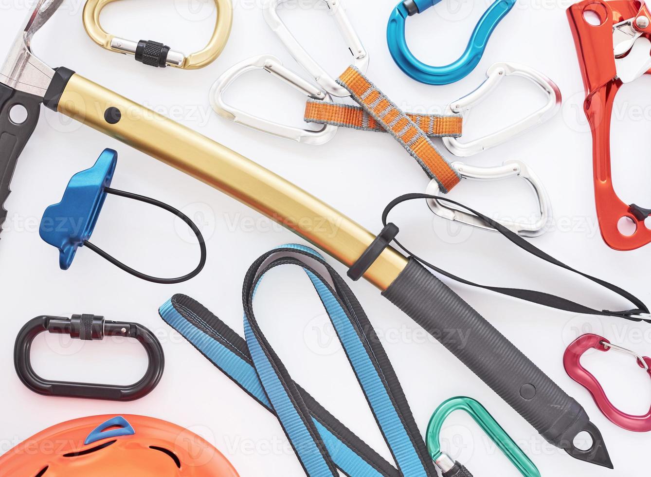 Looks like modern art. Climbing equipment for the safeness lying on the white table. Conception of extreme sports photo