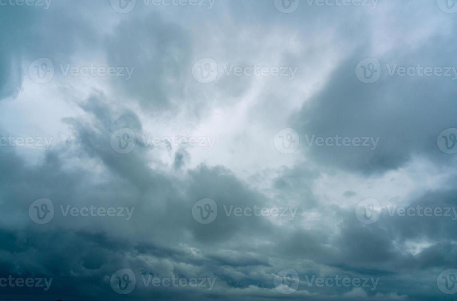 Dark dramatic sky and clouds. Background for death and sad concept. Gray sky and fluffy white clouds. Thunder and storm sky. Sad and moody sky. Nature background. Dead abstract background. Cloudscape. photo