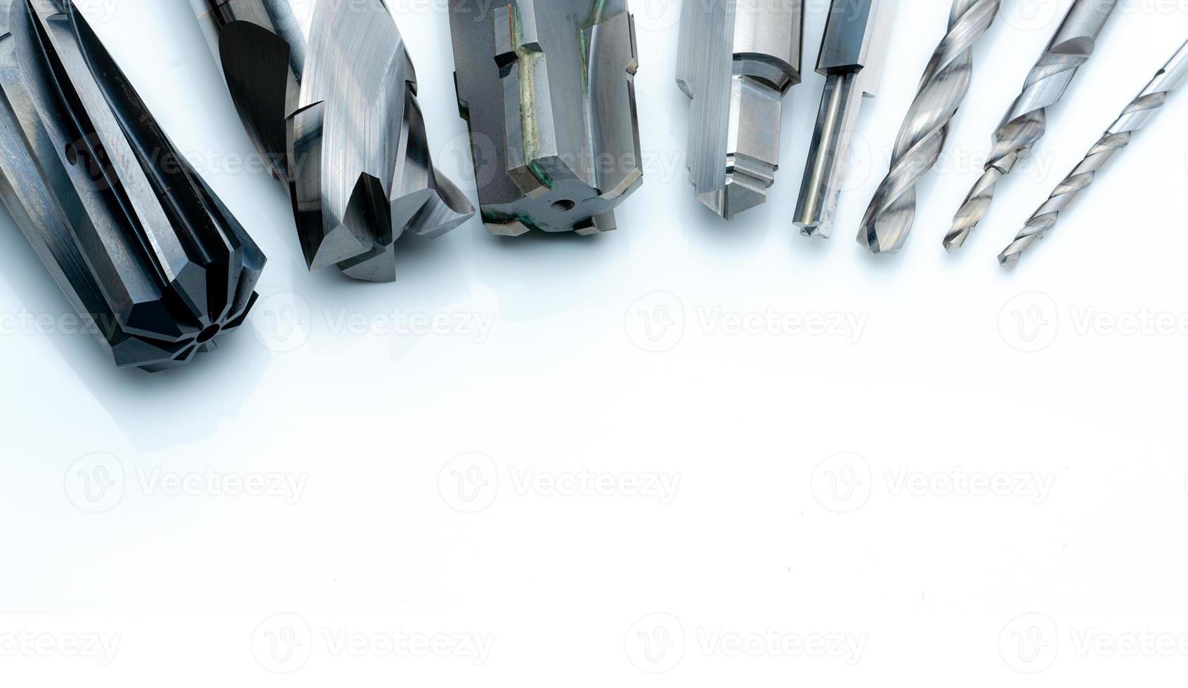 Special tools isolated on white background. Made to order special tools. Coated step drill and reamer detail. HSS cemented carbide. Carbide cutting tool for industrial applications. Engineering tools. photo