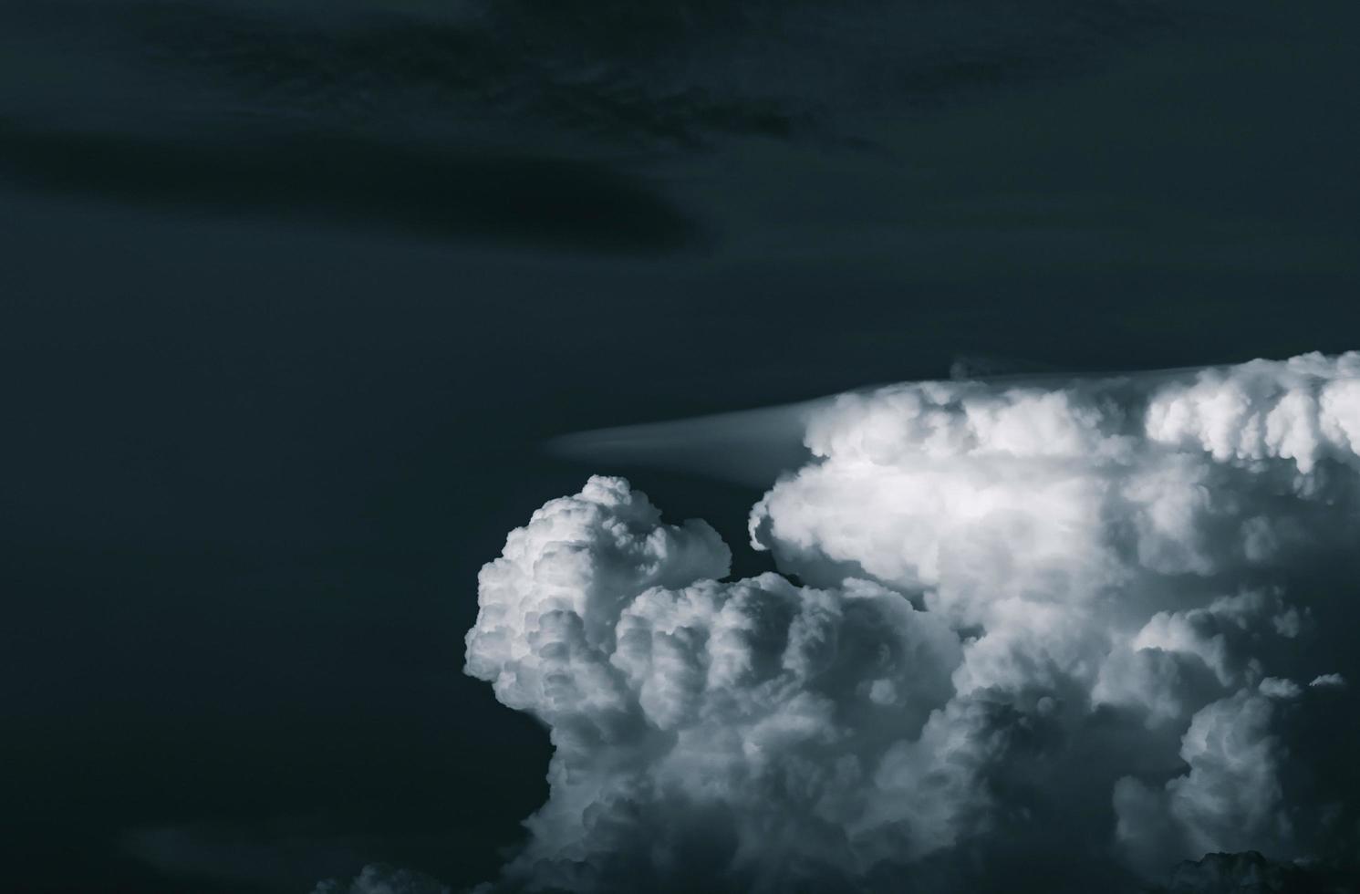 Dark dramatic sky and clouds. Background for death and sad concept. Gray sky and fluffy white clouds. Thunder and storm sky. Sad and moody sky. Nature background. Dead abstract background. Cloudscape. photo