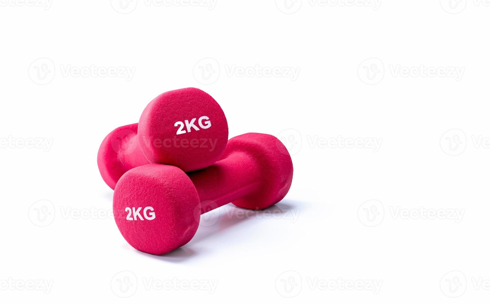 Set of red dumbbells isolated on white background. A pair of red neoprene dumbbells. Home gym equipment for exercise at home. Weight training equipment for sculpt arms, shoulders, back, and legs. photo