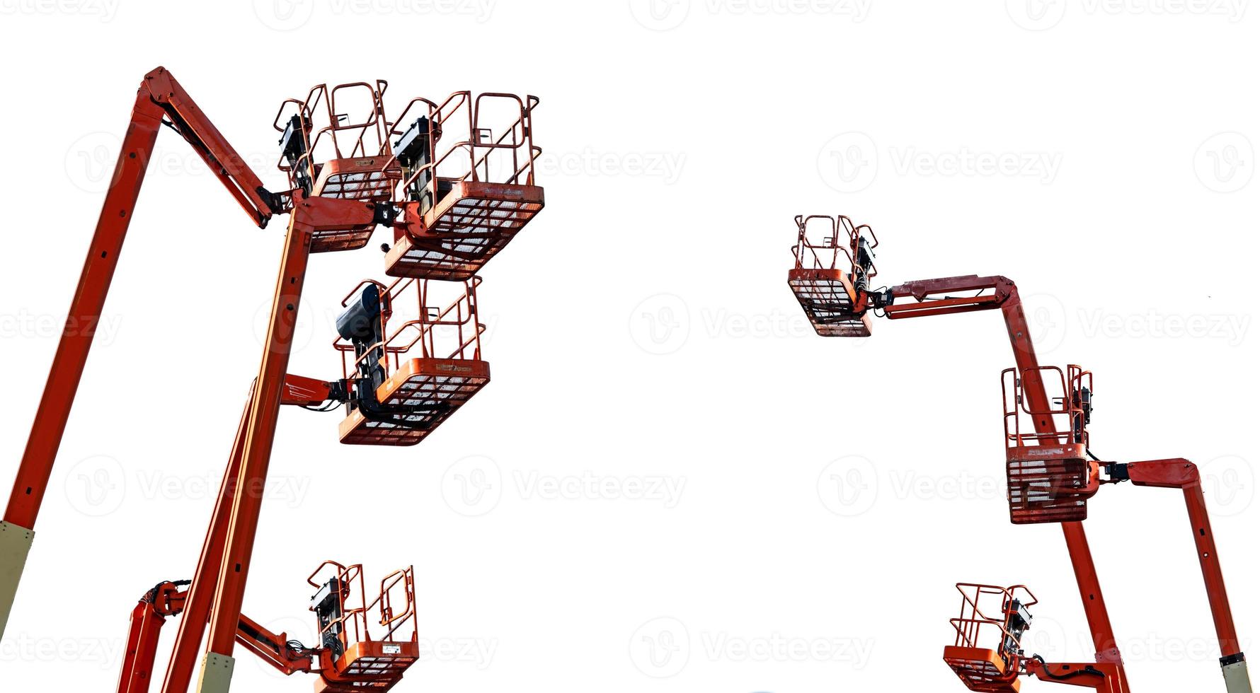 Orange articulated boom lift. Aerial platform lift. Telescopic boom lift isolated on white background. Mobile construction crane for rent and sale. Maintenance and repair hydraulic boom lift service. photo