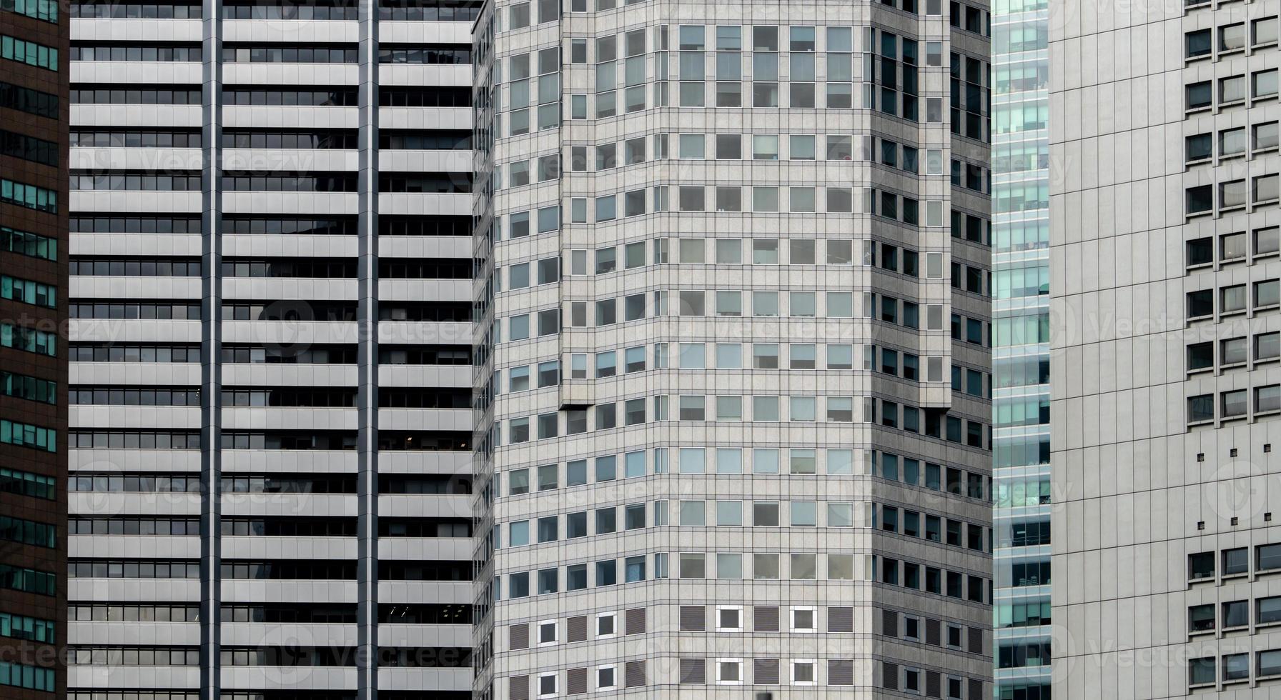 Modern futuristic glass building abstract background. Exterior of office glass building architecture. Facade of financial center business building. Energy saving architecture. Glass window of company. photo