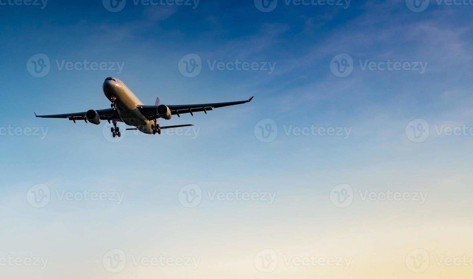 Commercial airline. Passenger plane landing at airport with beautiful blue sky and white clouds. Arrival flight. Welcome tourist from overseas. Vacation time. Happy trip. Airplane flying on bright sky photo