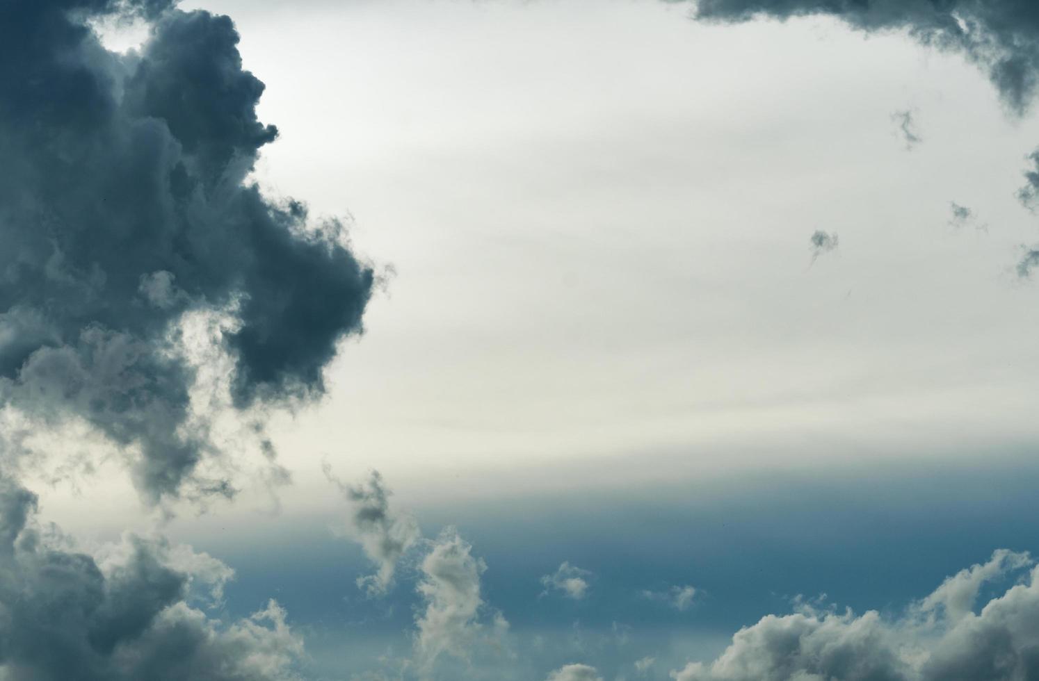 Dark dramatic sky and clouds. Background frame for death and sad concept. Gray sky and white clouds. Thunder and storm sky. Sad and moody sky. Nature background. Dead abstract background. Cloudscape. photo