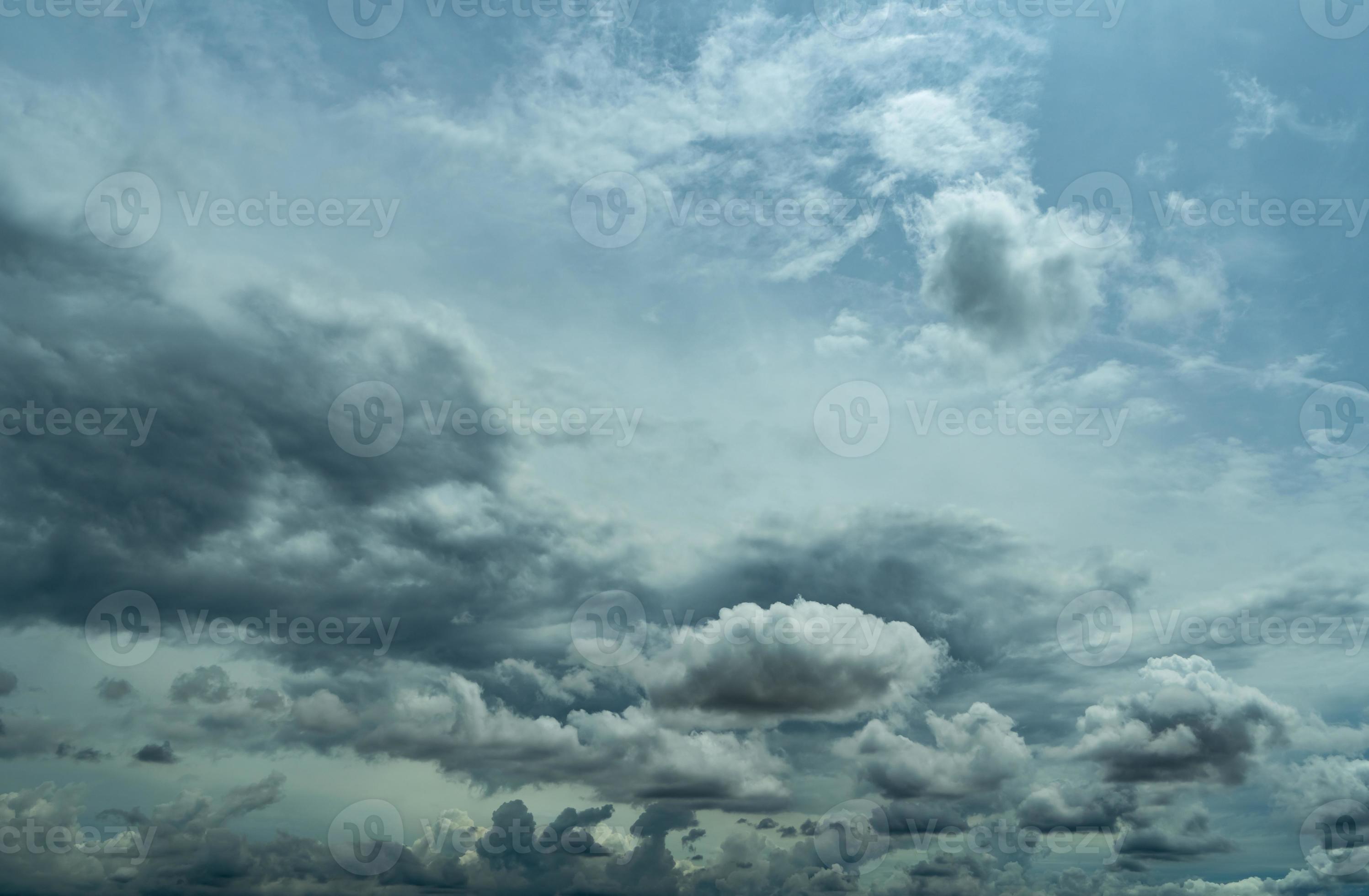 Blue sky and dark cumulus clouds. Cloudscape. Blue sky and fluffy