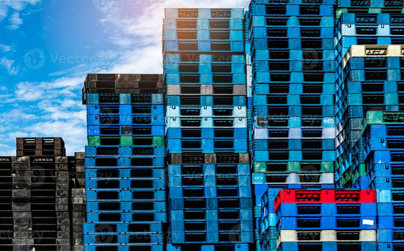 Pile of plastic shipping pallet. Industrial plastic pallet stacked at factory warehouse. Cargo and shipping concept. Plastic pallet rack for export delivery industry. Plastic pallet storage warehouse. photo