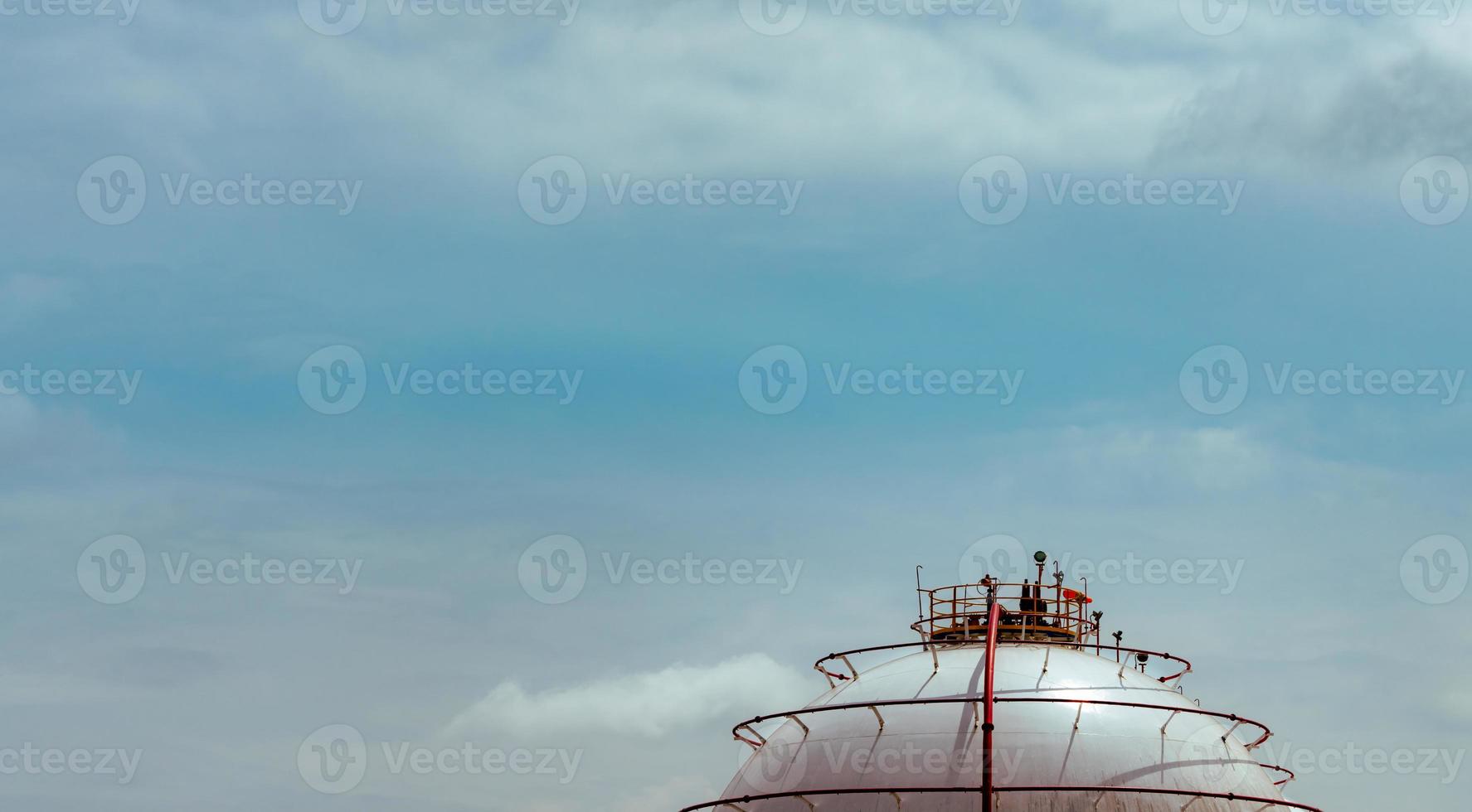 Industrial gas storage tank. LNG or liquefied natural gas storage tank. Spherical gas tank in petroleum refinery. Above-ground storage tank. Natural gas storage industry and global market consumption photo