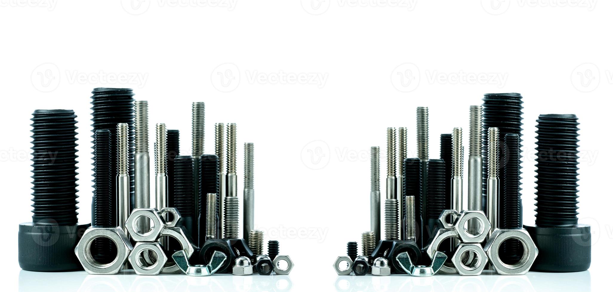 Metal bolts and nuts on white background. Fasteners equipment. Hardware tools. Stud bolt, hex nuts, and hex head bolts in workshop. Threaded fastener use in automotive engineering. Hexagonal bolt. photo