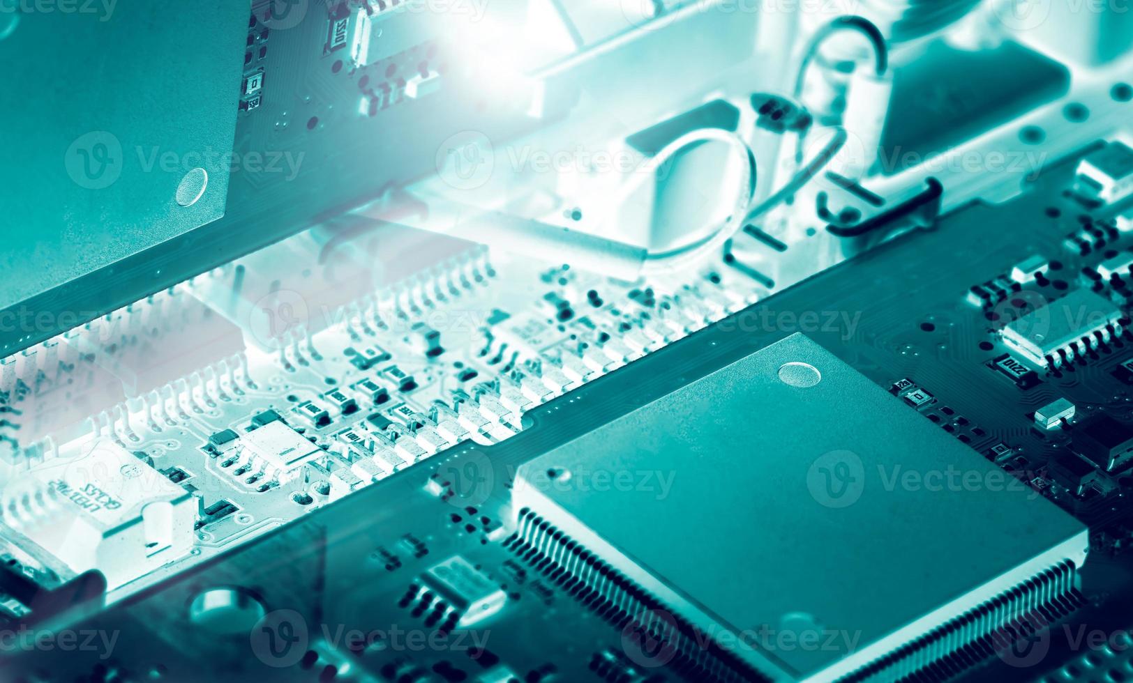 Electronic circuit board. Mainboard of computer. Computer integrated circuit board. Detail of electronic circuit board. Memory of digital information hardware. Electronic engineering technology. photo