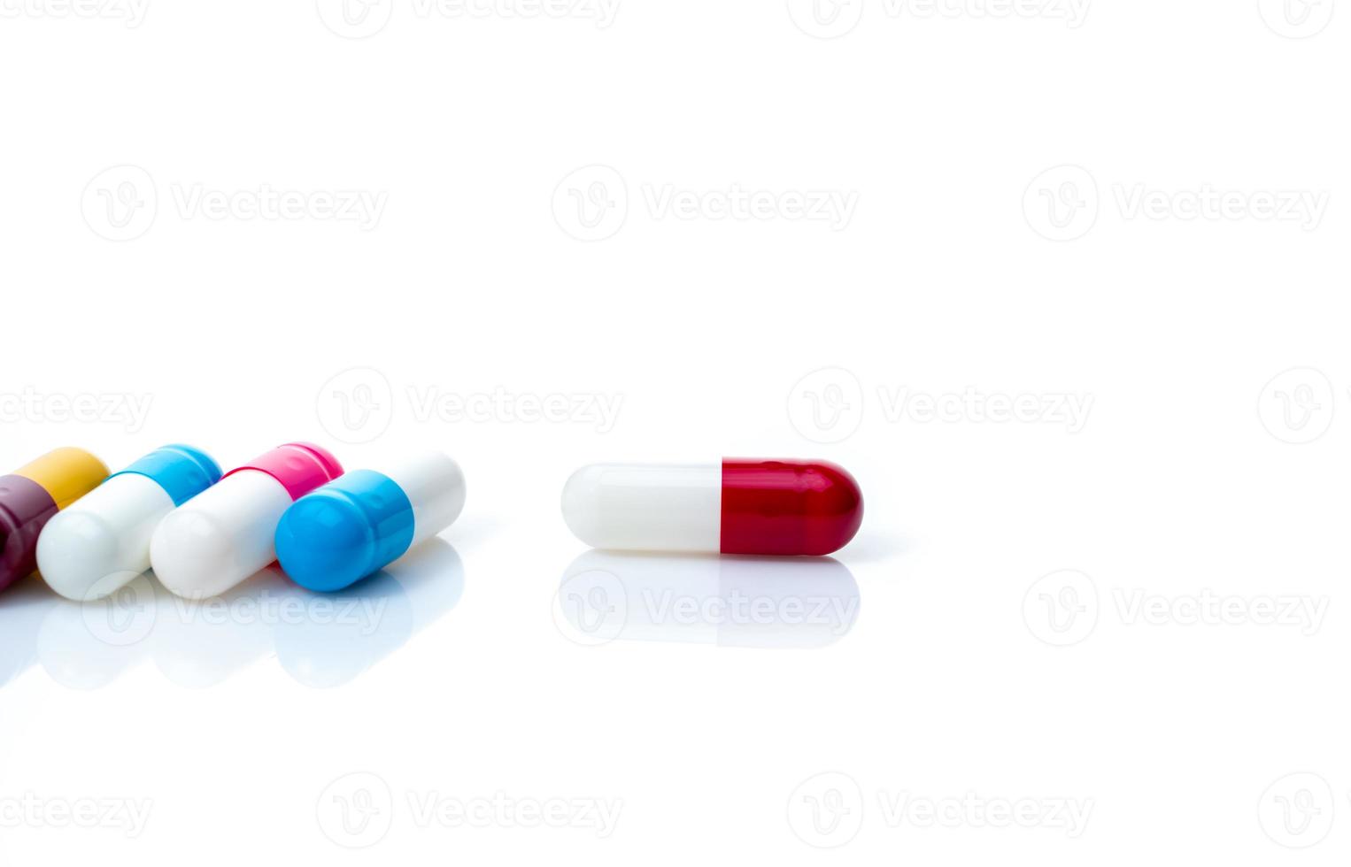 Antibiotic capsule pills on white background. Antibiotic drug resistance. Pharmacy banner. Pharmaceutical industry. Prescription drugs. Capsule pills with shadow. Pharmacology for pharmacist concept. photo