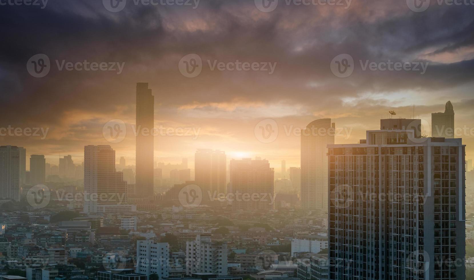 Cityscape in the morning with sunrise sky. Crowded of skyscraper buildings at downtown district. Financial and business center city. Urban skyline. Modern building in capital city. Real estate busines photo