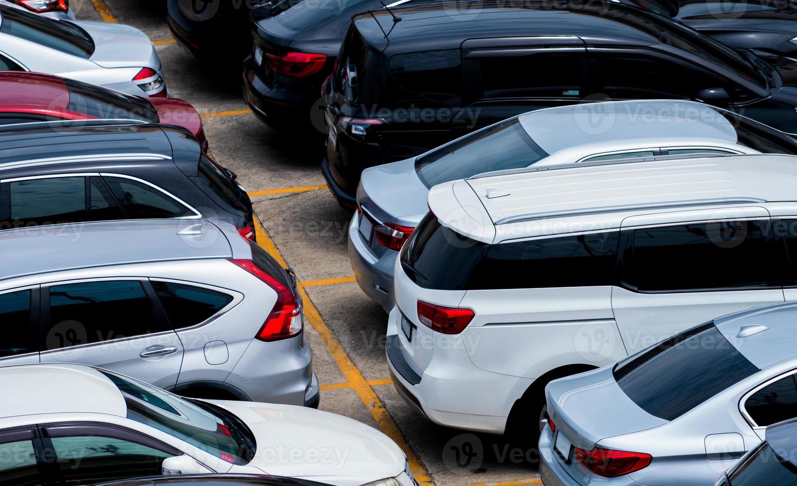 Car parked at parking lot of the airport for rental. Aerial view of car parking lot of the airport. Used luxury car for sale and rental service. Automobile parking space. Car dealership concept. photo