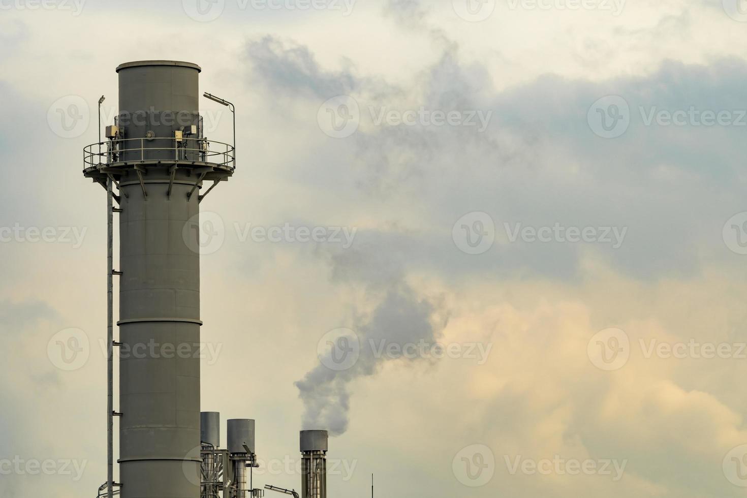 Air pollution from factory. Black smoke from chimney of industrial pipe. Global warming problem concept. Air pollutant emission factors. Air contamination. PM 2.5 dust. Triggers of asthma and COPD. photo