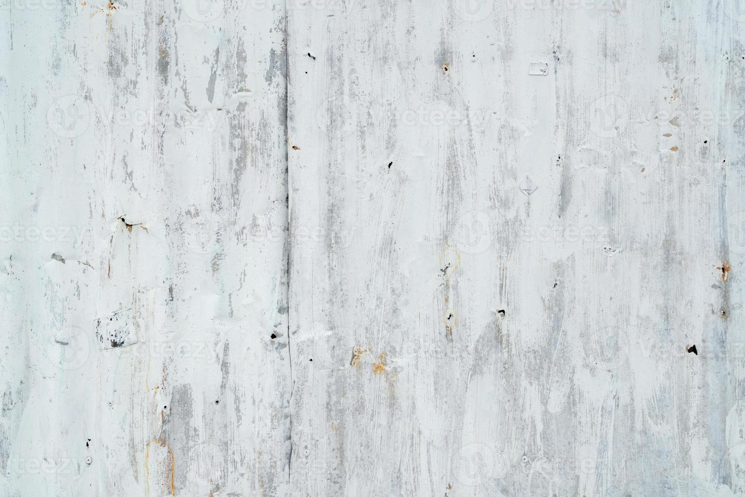 Galvanized sheet painted with white color. Empty white wall texture background. Peeling paint on white wall. Distorted striped gray galvanized sheet. Empty white and gray background for minimal life. photo