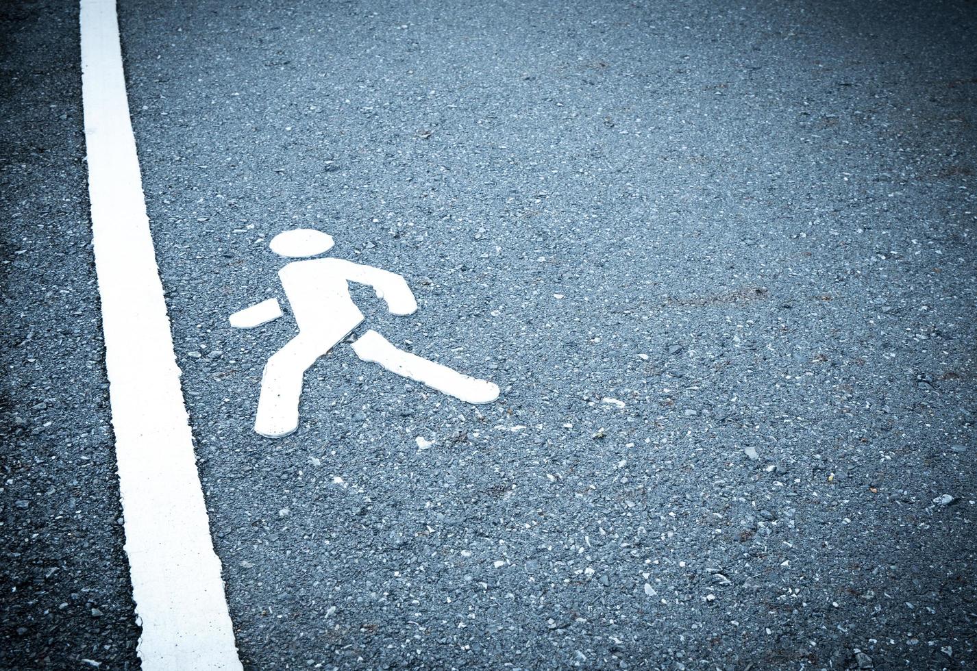 White painted sign on asphalt. People are going to step into the finish line. Do not be afraid to step over obstacles concept. pedestrian lane photo