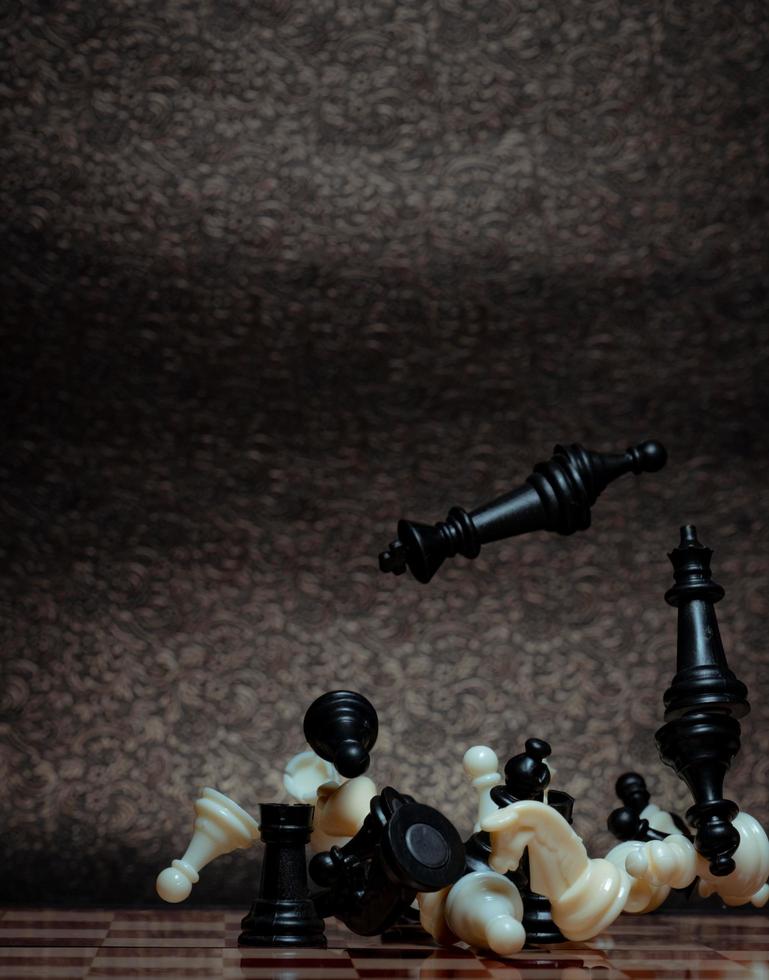 Chess board game. Business strategy management and success concept. Teamwork with competition and success strategic. Chess clash, bounce off on a board. Turn over chess board. Pieces of chess. Defeat. photo