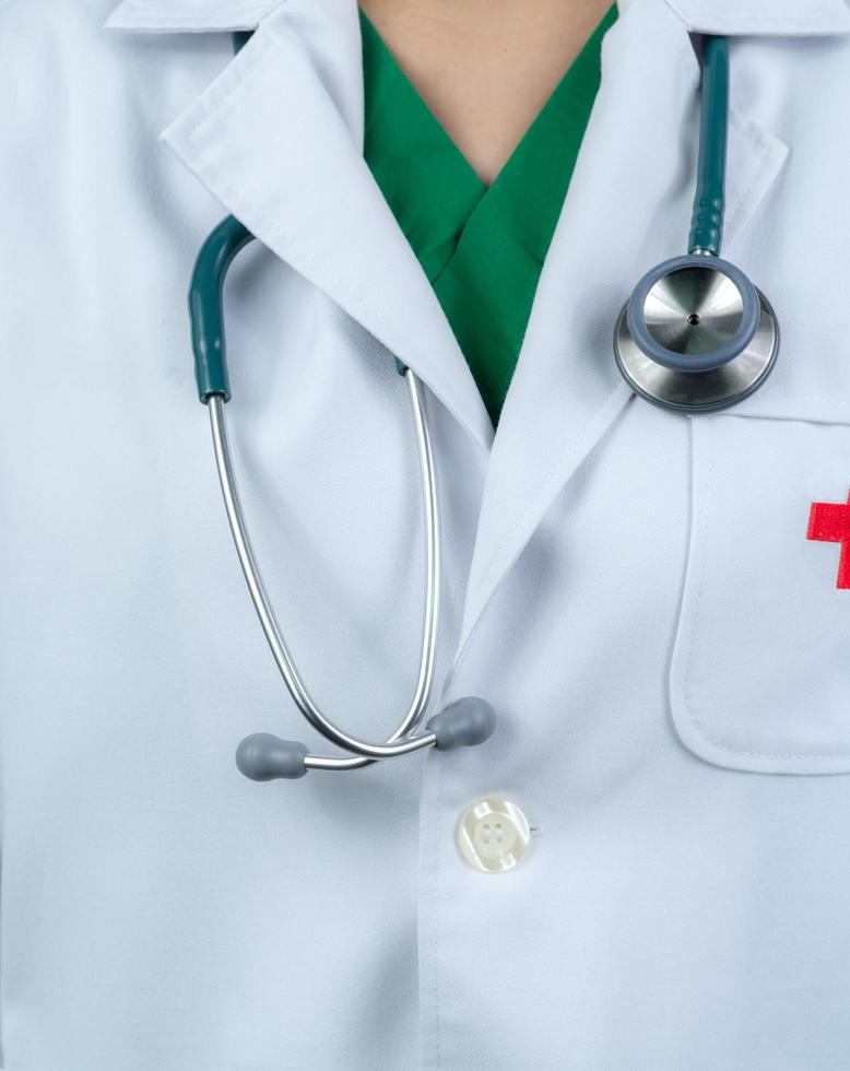 Doctor wear white uniform and green scrubs uniform inside. Doctor with stethoscope hang on neck. Healthcare professional. Patient trust concept. photo