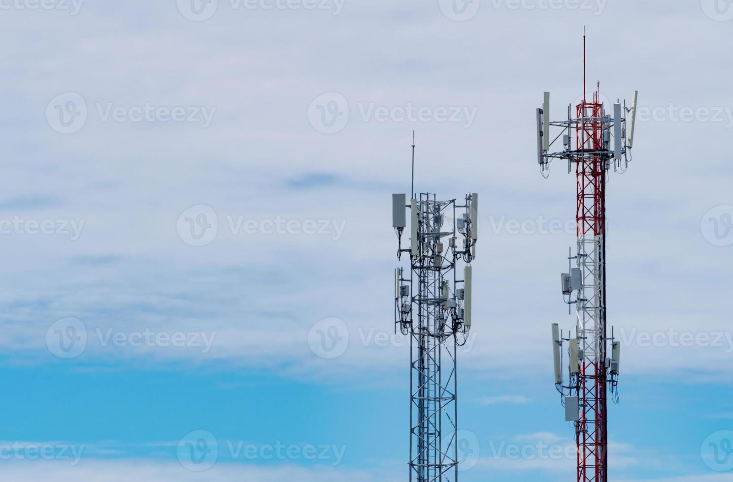 Telecommunication tower with blue sky and white clouds. Antenna on blue sky. Radio and satellite pole. Communication technology. Telecommunication industry. Mobile or telecom 4g network. Technology photo