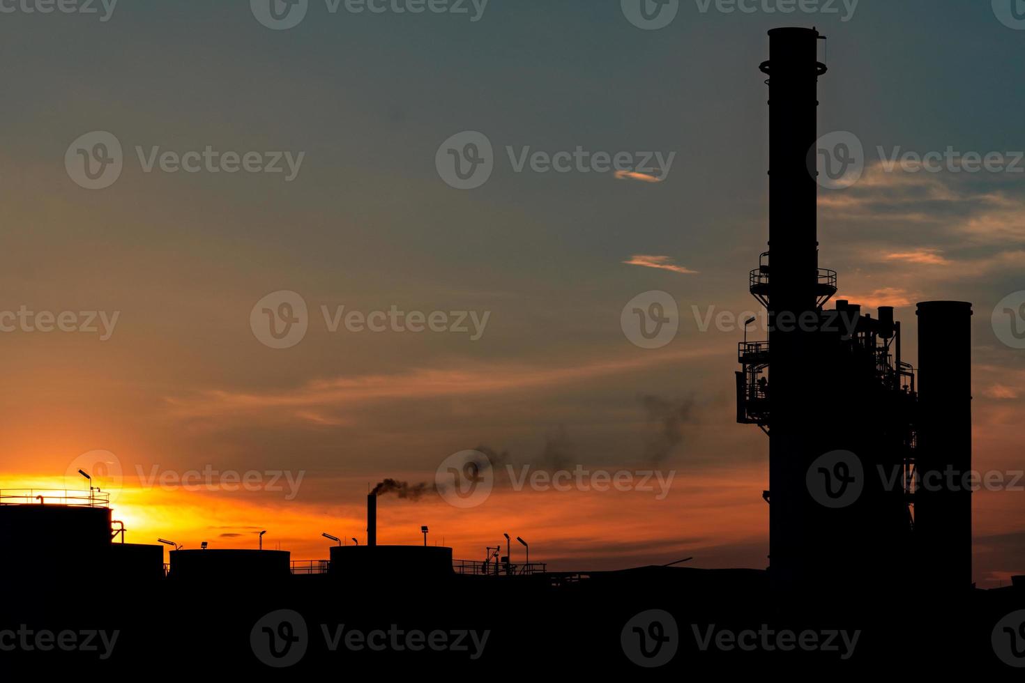 Gas turbine electrical power plant. Energy for support factory in industrial estate. Natural gas tank. Small gas power plant. Power plant using natural gas for fuel. Green energy. Dramatic sunset sky. photo