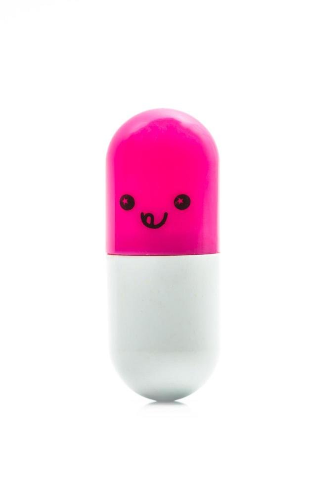 Cute pink and white capsule pill isolated on white background with copy space for text. Global healthcare concept. Healthy and happy life. photo