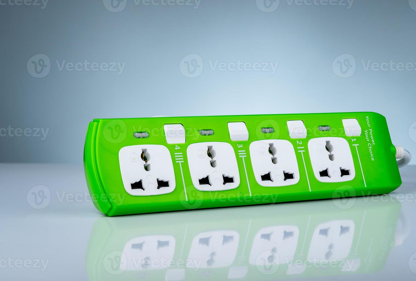 High quality and safety power strip with four electrical standard socket. Green universal plug with overload protection. Fire resistant material for cover. Circuit breaker. Individual switch. photo