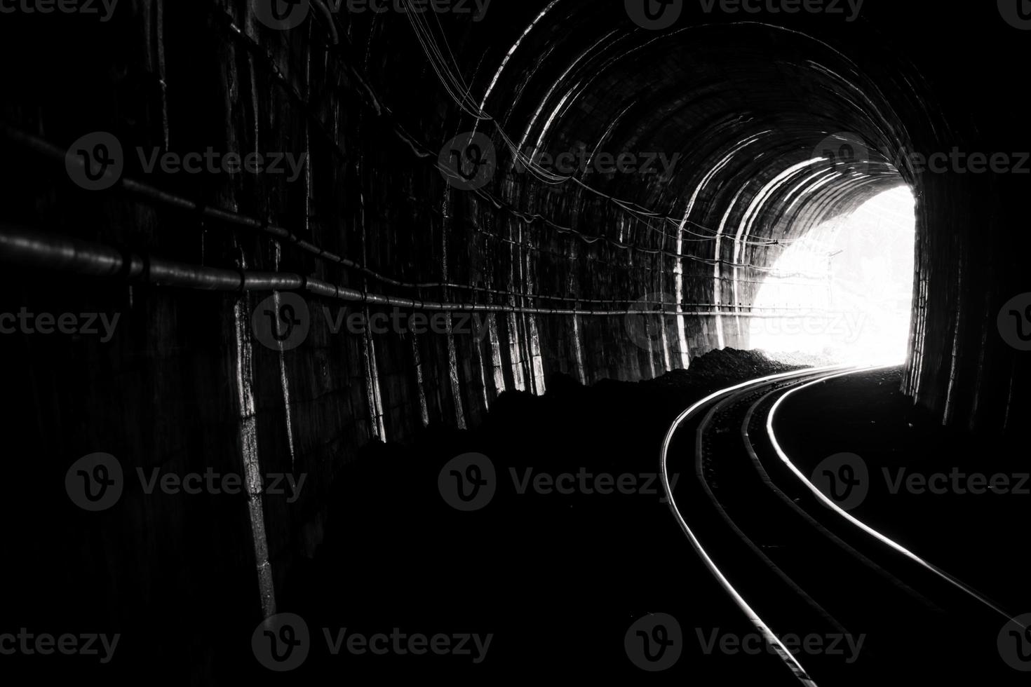 Train tunnel. Old railway in cave. Hope of life in the end of the way. Railroad of locomotive train in Thailand. Old architecture. Railway tunnel built in 1914. Travel and hope at the destination. photo