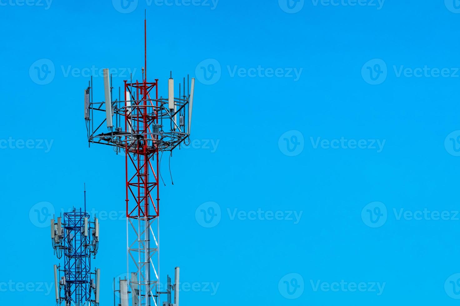 Telecommunication tower with blue sky and white clouds background. Antenna on blue sky. Radio and satellite pole. Communication technology. Telecommunication industry. Mobile or telecom 4g network. photo