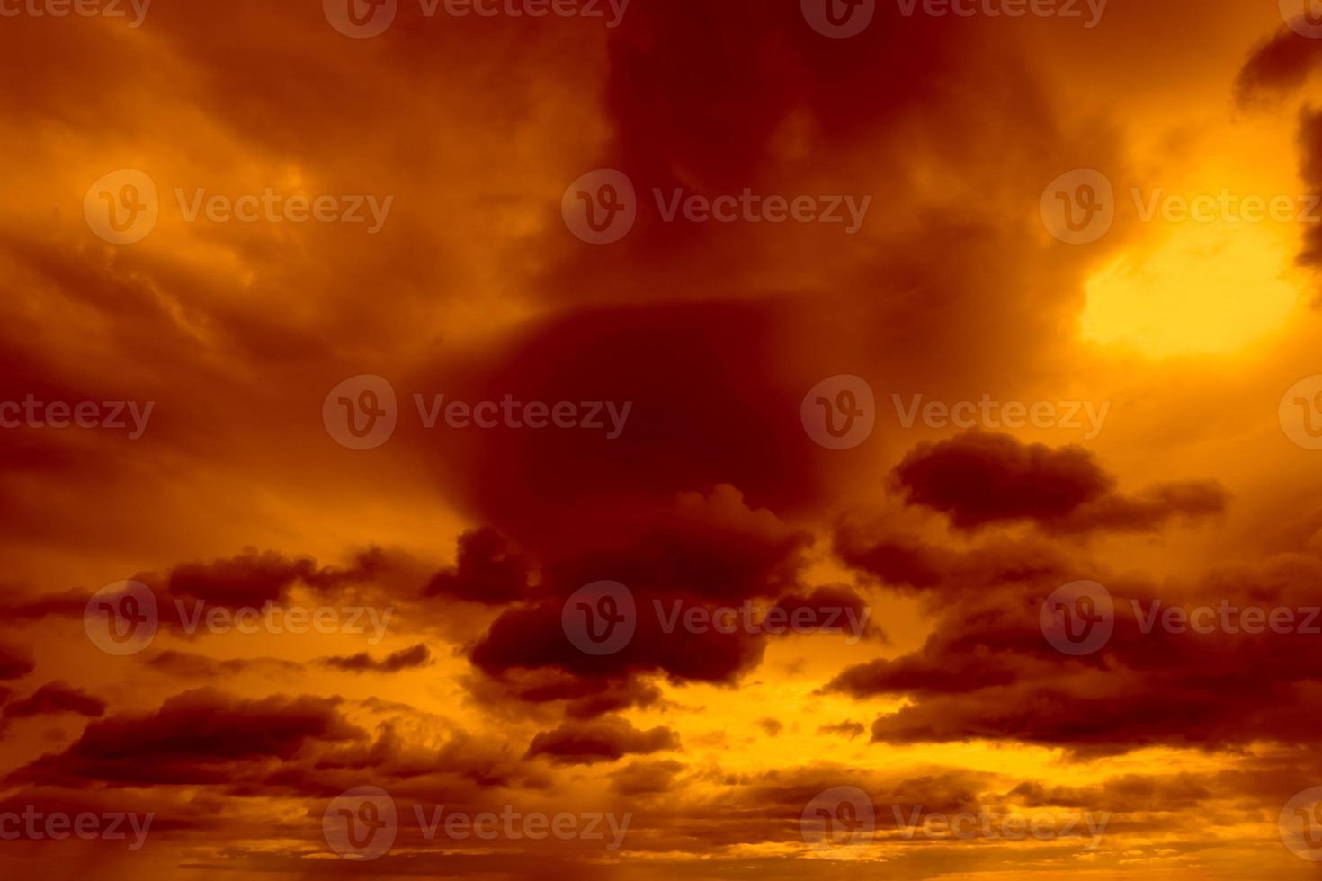 Beautiful sunset sky. Golden sunset sky with beautiful pattern of clouds. Orange, yellow, and dark clouds in the evening. Freedom and calm background. Beauty in nature. Powerful and spiritual scene. photo