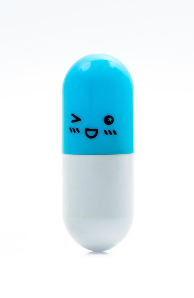 Blue and white capsule pill isolated on white background with copy space for text. Global healthcare concept. Healthy and happy life. photo