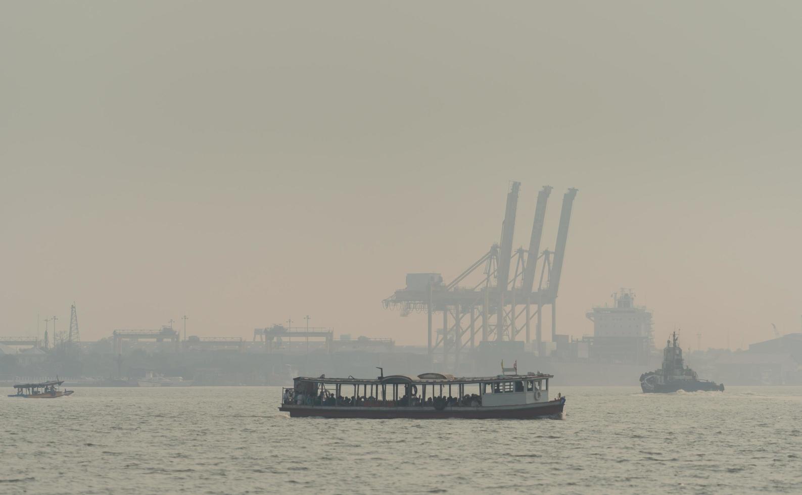 Air pollution at the pier. Bad air quality filled with dust causes of respiratory diseases. Global warming from air pollution problem. Environmental problem from gas carbon monoxide and dust. PM 2.5 photo