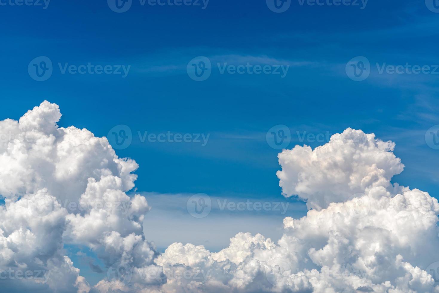 White fluffy clouds on blue sky. Soft touch feeling like cotton. White puffy clouds cape with space for text. Beauty in nature. Close-up white cumulus clouds texture background. Sky on sunny day. photo